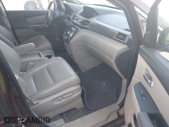 2014 Honda Odyssey Touring with VIN 5FNRL5H90EB080889, listed as a IAAI auction lot 42085305 with 123,286 mi miles and . Bid and sale history available at carsss.com. Image 5.