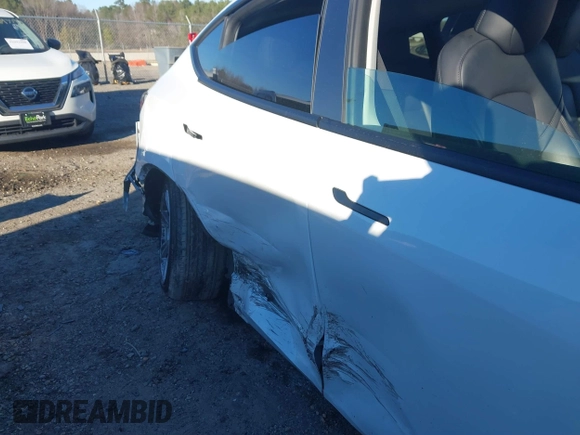 2023 Tesla Model Y Long Range with VIN 7SAYGAEE3PF753657, listed as a IAAI auction lot 41668917 with 33,301 mi miles and . Bid and sale history available at DreamBid. Image 6.