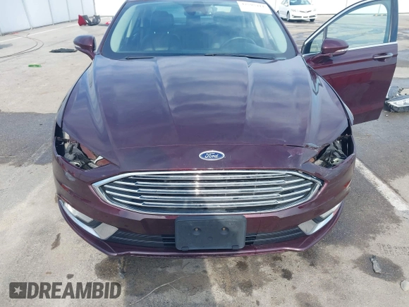 2017 Ford Fusion Titanium z VIN 3FA6P0K94HR271307, wystawiony jako IAAI lot #42595411 z przebiegiem 100 344 mil mil oraz . Historia ofert i sprzedaży dostępna na DreamBid. Obrazek 6.