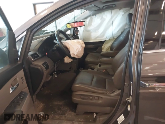 2014 Honda Odyssey Touring with VIN 5FNRL5H99EB105059, listed as a IAAI auction lot 42457672 with 240,581 mi miles and . Bid and sale history available at DreamBid. Image 5.