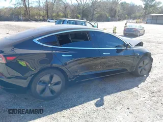 2019 Tesla Model 3 Mid Range with VIN 5YJ3E1EA2KF306286, listed as a IAAI auction lot 41699127 with 56,249 mi miles and . Bid and sale history available at DreamBid. Image 13.