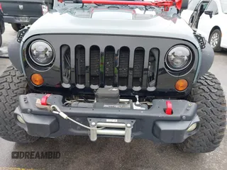 2013 Jeep Wrangler Rubicon 10th Anniversary with VIN 1C4BJWCG2DL651815, listed as a IAAI auction lot 41643919 with 98,297 mi miles and . Bid and sale history available at DreamBid. Image 6.