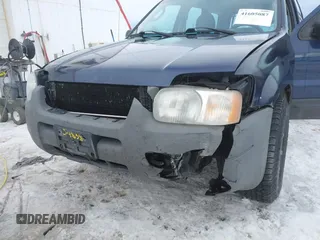 2003 Ford Escape XLS Popular with VIN 1FMYU92153KE01890, listed as a IAAI auction lot 41605087 with 109,411 mi miles. Bid and sale history available at carsss.com. Image 6.