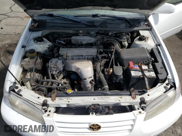 1997 Toyota Camry LE z VIN 4T1BG22KXVU163880, wystawiony jako Copart lot #56741295 z przebiegiem 132 863 mil mil oraz Szkoda całkowita • Salvage title. Historia ofert i sprzedaży dostępna na DreamBid. Obrazek 11.