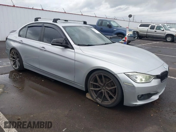 2014 BMW 3 Series 328i with VIN WBA3C1C58EK105766, listed as a IAAI auction lot 41692037 with 156,038 mi miles. Bid and sale history available at carsss.com. Image 1.