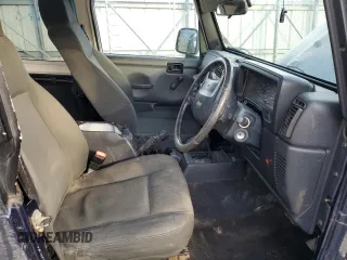 2006 Jeep Wrangler Sport Right Hand Drive with VIN 1J4F449S16P741407, listed as a Copart auction lot 88804015 with 182,059 mi miles and Salvage Title. Bid and sale history available at carsss.com. Image 7.