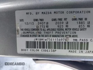 2014 Mazda 3 i Grand Touring with VIN JM1BM1W75E1156978, listed as a IAAI auction lot 41601276 with 164,976 mi miles and . Bid and sale history available at carsss.com. Image 9.