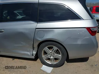 2012 Honda Odyssey Touring with VIN 5FNRL5H92CB108690, listed as a IAAI auction lot 41826580 with 150,327 mi miles and . Bid and sale history available at DreamBid. Image 17.