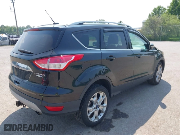 2015 Ford Escape Titanium with VIN 1FMCU9J96FUB58519, listed as a IAAI auction lot 42429369 with 125,541 mi miles and . Bid and sale history available at DreamBid. Image 4.