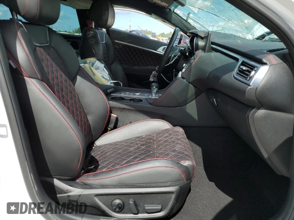 2023 Genesis G70 3.3T with VIN KMTG54TEXPU105082, listed as a Copart auction lot 65000724 with 12,941 mi miles and Salvage Title. Bid and sale history available at carsss.com. Image 7.