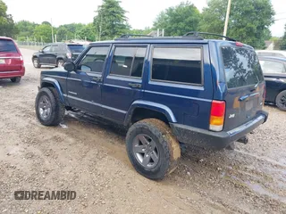 2001 Jeep Cherokee Sport with VIN 1J4FT48S71L525856, listed as a IAAI auction lot 42349383 with 218,122 mi miles and . Bid and sale history available at DreamBid. Image 3.