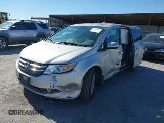 2014 Honda Odyssey EX-L with VIN 5FNRL5H63EB041106, listed as a IAAI auction lot 42294113 with 122,610 mi miles and . Bid and sale history available at DreamBid. Image 18.