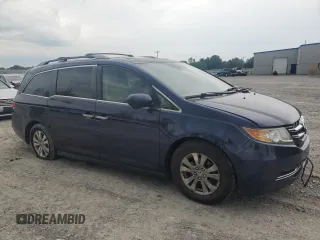 2014 Honda Odyssey EX-L with VIN 5FNRL5H63EB013483, listed as a Copart auction lot 63002435 with 127,059 mi miles and Salvage title. Bid and sale history available at DreamBid. Image 4.