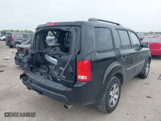 2009 Honda Pilot Touring with VIN 5FNYF388X9B024429, listed as a IAAI auction lot 41924600 with 125,400 mi miles. Bid and sale history available at carsss.com. Image 4.