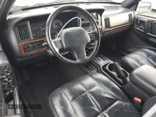 1997 Jeep Grand Cherokee Limited with VIN 1J4GZ78Y7VC772292, listed as a Copart auction lot 87692445 with 0 mi miles and Salvage Title. Bid and sale history available at carsss.com. Image 8.