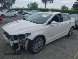 2013 Ford Fusion Titanium Hybrid with VIN 3FA6P0RUXDR386675, listed as a IAAI auction lot 42013986 with 89,349 mi miles. Bid and sale history available at carsss.com. Image 18.