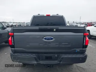 2023 Ford F-150 Lightning Pro with VIN 1FTVW1EL8PWG48559, listed as a IAAI auction lot 42033123 with 8,845 mi miles and . Bid and sale history available at DreamBid. Image 16.