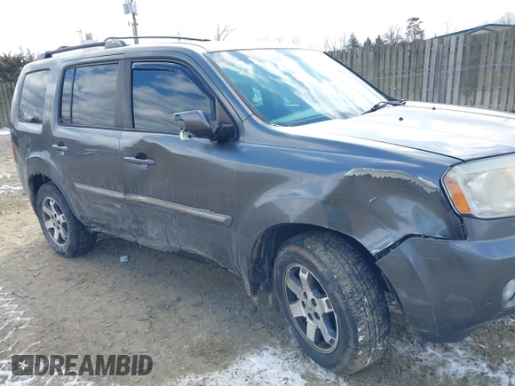2011 Honda Pilot Touring with VIN 5FNYF4H98BB016012, listed as a IAAI auction lot 41634844 with 202,160 mi miles. Bid and sale history available at carsss.com. Image 6.