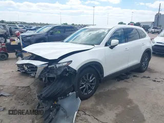 2022 Mazda CX-9 Touring with VIN JM3TCBCY0N0608052, listed as a IAAI auction lot 42027465 with 65,313 mi miles and . Bid and sale history available at DreamBid. Image 2.