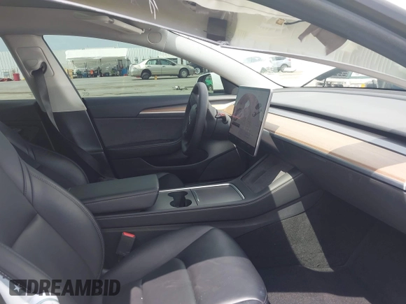 2021 Tesla Model 3 Performance with VIN 5YJ3E1EC2MF084594, listed as a IAAI auction lot 42030339 with 43,215 mi miles and . Bid and sale history available at DreamBid. Image 5.