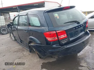 2013 Dodge Journey SE z VIN 3C4PDCAB7DT701180, wystawiony jako IAAI lot #41609700 z przebiegiem 118 207 mil mil oraz . Historia ofert i sprzedaży dostępna na DreamBid. Obrazek 3.