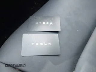 2023 Tesla Model 3 with VIN 5YJ3E1EA5PF407054, listed as a IAAI auction lot 42313770 with 57,621 mi miles and . Bid and sale history available at DreamBid. Image 11.