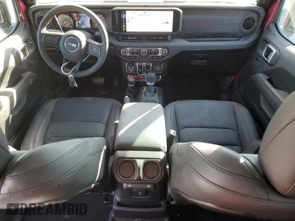 2024 Jeep Wrangler Rubicon with VIN 1C4PJXFG9RW346079, listed as a Copart auction lot 77006914 with 2,446 mi miles and Salvage Title. Bid and sale history available at DreamBid. Image 8.
