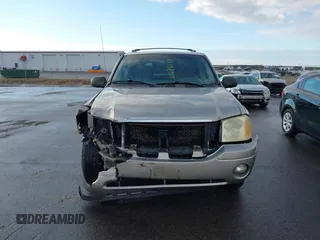 2003 GMC Envoy SLT with VIN 1GKDT13S532308502, listed as a IAAI auction lot 41676188 with 218,626 mi miles. Bid and sale history available at carsss.com. Image 12.
