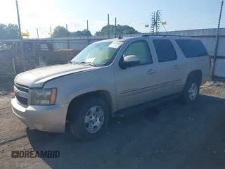 2007 Chevrolet Suburban LS with VIN 1GNFC16007J203853, listed as a IAAI auction lot 39454050 with 246,521 mi miles and . Bid and sale history available at DreamBid. Image 2.