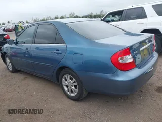 2004 Toyota Camry LE with VIN 4T1BF32K54U572537, listed as a IAAI auction lot 41850322 with 167,076 mi miles and . Bid and sale history available at DreamBid. Image 3.