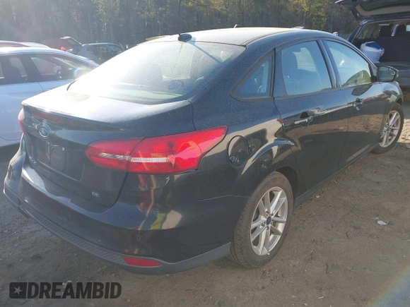 2015 Ford Focus SE with VIN 1FADP3F29FL210973, listed as a IAAI auction lot 41874367 with 128,705 mi miles. Bid and sale history available at carsss.com. Image 4.