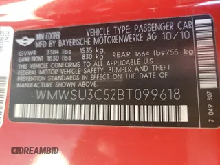 2011 MINI Hardtop z VIN WMWSU3C52BT099618, wystawiony jako Copart lot #57863215 z przebiegiem 98 302 mil mil oraz Tytuł czysty. Historia ofert i sprzedaży dostępna na DreamBid. Obrazek 12.