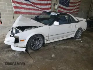 1989 Toyota MR2 z VIN JT2AW15J7K0154517, wystawiony jako Copart lot #77944134 z przebiegiem 204 412 mil mil oraz Szkody całkowita. Historia ofert i sprzedaży dostępna na DreamBid. Obrazek 1.