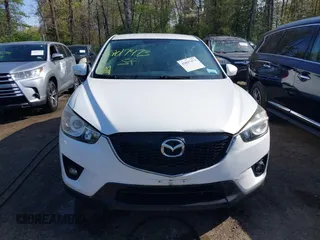 2014 Mazda CX-5 Touring with VIN JM3KE2CY5E0329783, listed as a IAAI auction lot 42017473 with 121,175 mi miles. Bid and sale history available at carsss.com. Image 12.