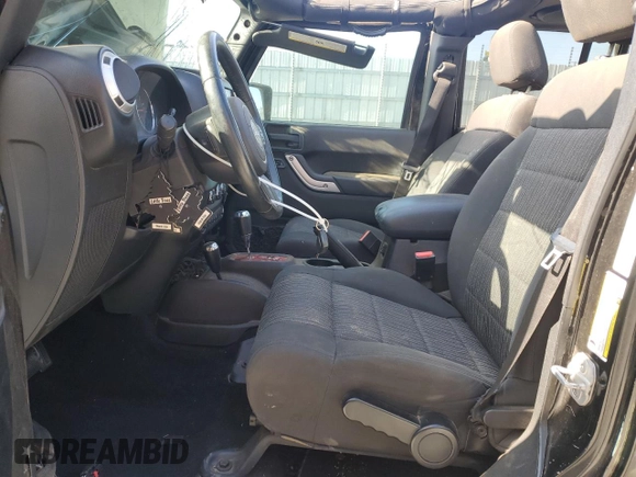 2012 Jeep Wrangler Unlimited Sahara with VIN 1C4BJWEG5CL235835, listed as a Copart auction lot 60673555 with 86,606 mi miles and Salvage title. Bid and sale history available at DreamBid. Image 7.