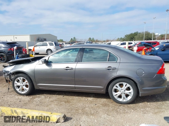 2012 Ford Fusion SE z VIN 3FAHP0HG0CR436745, wystawiony jako IAAI lot #41598812 z przebiegiem 116 305 mil mil oraz . Historia ofert i sprzedaży dostępna na DreamBid. Obrazek 15.