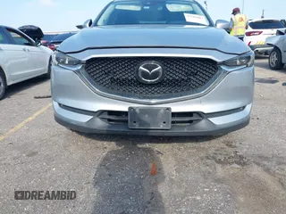 2020 Mazda CX-5 Grand Touring with VIN JM3KFADM5L0739306, listed as a IAAI auction lot 42215667 with 126,100 mi miles and . Bid and sale history available at DreamBid. Image 12.