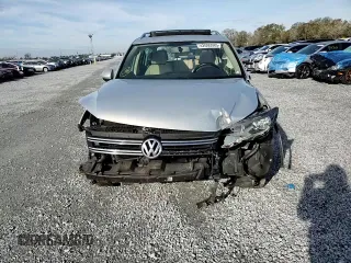 2014 Volkswagen Tiguan SE z VIN WVGAV3AXXEW502310, wystawiony jako Copart lot #42095985 z przebiegiem 130 033 mil mil oraz Szkoda całkowita • Salvage title. Historia ofert i sprzedaży dostępna na DreamBid. Obrazek 11.