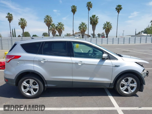 2015 Ford Escape SE with VIN 1FMCU9G93FUA26339, listed as a IAAI auction lot 42039281 with 185,729 mi miles and . Bid and sale history available at DreamBid. Image 14.