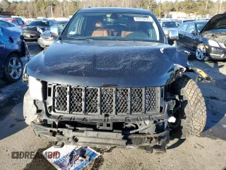 2013 Jeep Grand Cherokee Overland with VIN 1C4RJFCTXDC525097, listed as a Copart auction lot 42250875 with 214,368 mi miles and Salvage Title. Bid and sale history available at carsss.com. Image 5.