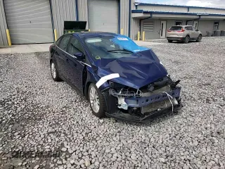 2016 Ford Focus Titanium z VIN 1FADP3J27GL310367, wystawiony jako Copart lot #55048005 z przebiegiem 86 676 mil mil oraz Szkoda całkowita • Salvage title. Historia ofert i sprzedaży dostępna na DreamBid. Obrazek 14.
