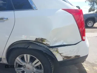 2015 Cadillac SRX Luxury Collection with VIN 3GYFNBE38FS584296, listed as a IAAI auction lot 41950092 with 56,691 mi miles and . Bid and sale history available at carsss.com. Image 12.