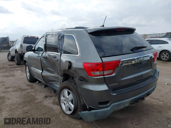 2013 Jeep Grand Cherokee Laredo with VIN 1C4RJEAG2DC571569, listed as a IAAI auction lot 41100518 with 98,265 mi miles. Bid and sale history available at carsss.com. Image 3.
