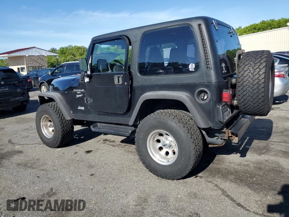 2001 Jeep Wrangler Sport with VIN 1J4FA49S21P339042, listed as a Copart auction lot 56922555 with 113,315 mi miles and Salvage title. Bid and sale history available at DreamBid. Image 2.