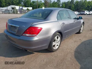 2006 Acura RL z VIN JH4KB16516C008190, wystawiony jako IAAI lot #42433002 z przebiegiem 216 426 mil mil oraz . Historia ofert i sprzedaży dostępna na DreamBid. Obrazek 4.