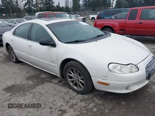 2000 Chrysler LHS with VIN 2C3HC56G4YH382301, listed as a IAAI auction lot 41324699 with 220,076 mi miles. Bid and sale history available at carsss.com. Image 1.