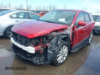 2015 Mazda CX-5 Grand Touring with VIN JM3KE4DY7F0477770, listed as a IAAI auction lot 41617849 with 106,135 mi miles. Bid and sale history available at carsss.com. Image 2.