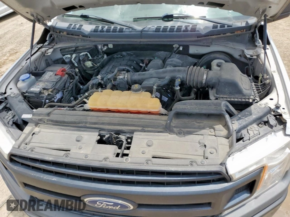 2019 Ford F-150 XL with VIN 1FTMF1CB8KKC24255, listed as a Copart auction lot 64755525 with 100,980 mi miles and Salvage title. Bid and sale history available at DreamBid. Image 11.