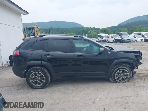 2021 Jeep Cherokee Trailhawk with VIN 1C4PJMBX0MD167941, listed as a IAAI auction lot 42507379 with 70,414 mi miles and . Bid and sale history available at DreamBid. Image 14.