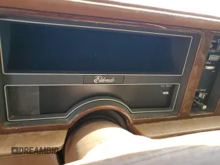1990 Cadillac Eldorado z VIN 1G6EL1334LU616468, wystawiony jako Copart lot #76398934 z przebiegiem Nie podano mil oraz Szkody całkowita. Historia ofert i sprzedaży dostępna na DreamBid. Obrazek 9.